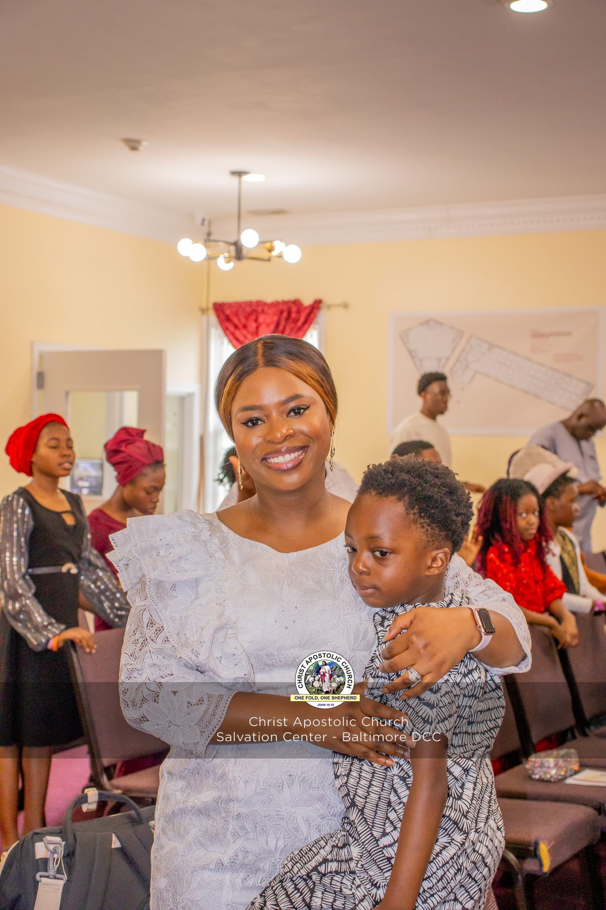 A mother embracing a child